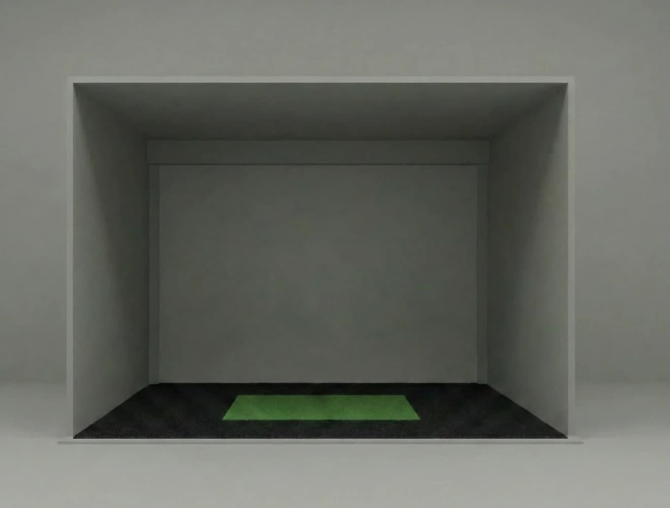 A minimalist, grey rectangular room with a green square patch on the black floor, viewed from the front.